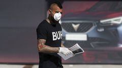 In this photo provided by FC Barcelona, Arturo Vidal walks wearing a protective face mask and gloves at the club&#039;s training ground in Barcelona, Spain, on Wednesday May 6, 2020. Soccer players in Spain returned to their team&#039;s training camps Wednesday for the first time since the country entered a lockdown nearly two months ago because of the coronavirus pandemic. Players for Barcelona, Real Madrid, Atl&eacute;tico Madrid and other clubs started preparing for the return to training this week, and they were all expected to be tested for COVID-19 and should be cleared to practice once the results are back. (Miguel Ruiz/FC Barcelona via AP)