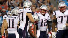 CHARLOTTE, NC - AUGUST 24:  Tom Brady #12 looks to teammate Julian Edelman #11 of the New England Patriots in the huddle against the Carolina Panthers in the second quarter during their game at Bank of America Stadium on August 24, 2018 in Charlotte, North Carolina.  (Photo by Streeter Lecka/Getty Images)