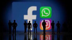 Small toy figures are seen in front of displayed Facebook, Whatsapp and Instagram logos in this illustration taken October 4, 2021. REUTERS/Dado Ruvic/Illustration