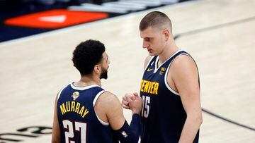 Jun 4, 2023; Denver, CO, USA; Denver Nuggets center Nikola Jokic (15) and guard Jamal Murray (27) react in the second quarter against the Miami Heat in game two of the 2023 NBA Finals at Ball Arena. Mandatory Credit: Isaiah J. Downing-USA TODAY Sports