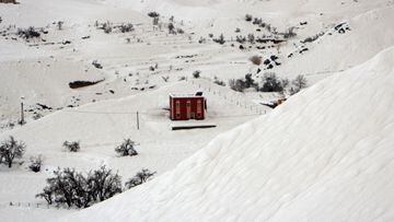 A house is seen covered in snow in Ouarzazate, on February 18, 2023. (Photo by AFP)
