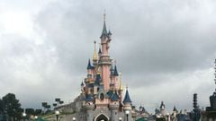 (FILES) In this file photograph taken on July 15, 2020, visitors and staff wearing protective face masks, walk down the Main Street of Disneyland Paris in Marne-la-Vallee on the outskirts of Paris. - Disneyland Paris, normally Europe&#039;s biggest touris