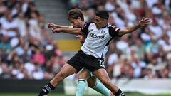 Brentford's Danish midfielder #08 Mathias Jensen challenges Fulham's Mexican striker #07 Raul Jimenez (front) during the English Premier League football match between Fulham and Brentford at Craven Cottage in London on August 19, 2023. (Photo by JUSTIN TALLIS / AFP) / RESTRICTED TO EDITORIAL USE. No use with unauthorized audio, video, data, fixture lists, club/league logos or 'live' services. Online in-match use limited to 120 images. An additional 40 images may be used in extra time. No video emulation. Social media in-match use limited to 120 images. An additional 40 images may be used in extra time. No use in betting publications, games or single club/league/player publications. / 