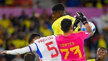 Chile's goalkeeper Brayan Cortes fights for the ball during the 2026 FIFA World Cup South American qualification football match between Ecuador and Chile