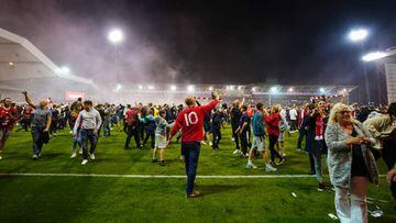 Nottingham Forest fans celebrate on the pitch after they reach the play off final during the Sky Bet Championship play-off semi-final, second leg match at the City Ground, Nottingham. Picture date: Tuesday May 17, 2022. (Photo by Zac Goodwin/PA Images via Getty Images)