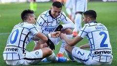 TURIN, ITALY - MARCH 14: Lautaro Martinez (L) of Internazionale celebrates with team mates (L - R) Alexis Sanchez and Achraf Hakimi after scoring their side&#039;s second goal during the Serie A match between Torino FC  and FC Internazionale at Stadio Olimpico di Torino on March 14, 2021 in Turin, Italy. Sporting stadiums around Italy remain under strict restrictions due to the Coronavirus Pandemic as Government social distancing laws prohibit fans inside venues resulting in games being played behind closed doors. (Photo by Valerio Pennicino/Getty Images)