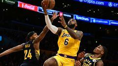 Nov 28, 2022; Los Angeles, California, USA; Los Angeles Lakers forward LeBron James (6) shoots against Indiana Pacers guard Buddy Hield (24) and guard Bennedict Mathurin (00) in the second half at Crypto.com Arena. Mandatory Credit: Richard Mackson-USA TODAY Sports