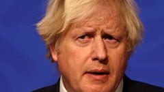 Britain&#039;s Prime Minister Boris Johnson holds a press conference for the latest Covid-19 update in the Downing Street briefing room in central London on December 8, 2021. - The UK government is reintroducing Covid-19 restrictions due to the Omicron va
