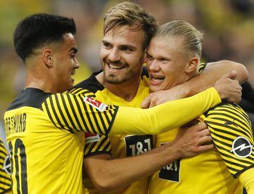 Borussia Dortmund's Erling Braut Haaland celebrates scoring their third goal with teammate.