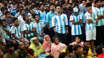 Football fans watch the Qatar 2022 World Cup Group C football match between Argentina and Saudi Arabia on a big screen at Dhaka University area in Dhaka, Bangladesh on November 22, 2022. (Photo by Syed Mahamudur Rahman/NurPhoto via Getty Images)