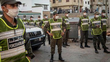 Members of Morocco&#039;s Interior Ministry Auxiliary Forces patrol a neighbourhood to enforce the reimposed lockdown due to a spike in coronavirus (COVID-19) cases, in the capital Rabat&#039;s district of Takadoum on August 17, 2020. (Photo by FADEL SENN