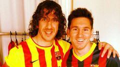 Puyol with Messi.