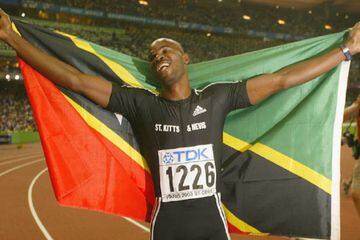 Collins celebrates his 100m win at the 2003 World Championships.