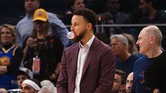 Jan 16, 2020; San Francisco, California, USA; Golden State Warriors guard Stephen Curry (30) blows a bubble of bubble gum from the bench during the second quarter against the Denver Nuggets at Chase Center. Mandatory Credit: Kelley L Cox-USA TODAY Sports