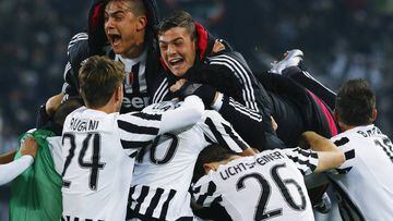 Simone Zaza is mobbed by teammates after scoring the winner. 