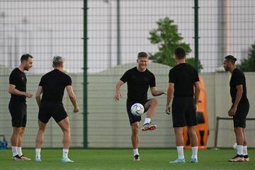 Denmark's forward Andreas Cornelius (C) controls a ball during a training session at Al Sailiya SC 