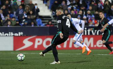 Sergio Ramos scores their third goal from the penalty spot.