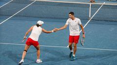 Poland�s Hubert Hurkacz (R) and Iga Swiatek gesture as they compete against Brazil�s Marcelo Melo and Beatriz Haddad Maia during their mixed doubles match at the United Cup tennis tournament in Perth on December 30, 2023. (Photo by COLIN MURTY / AFP) / -- IMAGE RESTRICTED TO EDITORIAL USE - STRICTLY NO COMMERCIAL USE --
