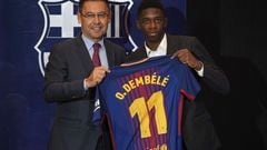 Barcelona's new player Ousmane Dembele (R) poses with his new jersey next to Barcelona's president Josep Maria Bartomeu at the Camp Nou stadium in Barcelona, during his official presentation at the Catalan football club, on August 28, 2017.
French starlet
