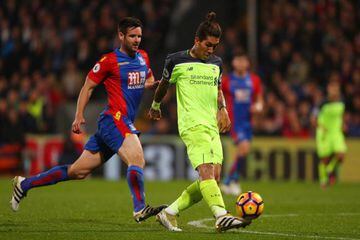Roberto Firmino dinks in Liverpool's fourth against Crystal Palace.