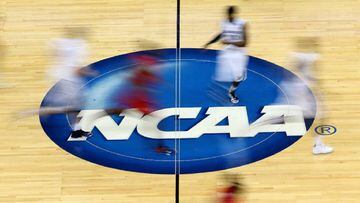 Four basketball coaches, Adidas executive charged in college payoff scandal