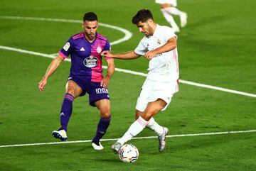 Marco Asensio in action with Real Valladolid's Bruno.