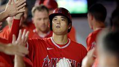 Aug 25, 2023; New York City, New York, USA; Los Angeles Angels designated hitter Shohei Ohtani (17) high fives teammates in the dugout after scoring on a single by third baseman Mike Moustakas (not pictured) during the third inning Los Angeles Angels manager Phil Nevin (88) at Citi Field. Mandatory Credit: Brad Penner-USA TODAY Sports
