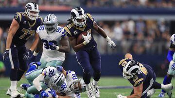 ARLINGTON, TX - OCTOBER 01: Todd Gurley #30 of the Los Angeles Rams runs the ball past Jeff Heath #38 and Brian Price #92 of the Dallas Cowboys in the third quarter at AT&amp;T Stadium on October 1, 2017 in Arlington, Texas.   Ronald Martinez/Getty Images/AFP == FOR NEWSPAPERS, INTERNET, TELCOS &amp; TELEVISION USE ONLY ==