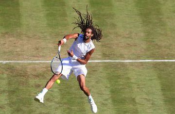 Germany's Dustin Brown returns against Britain's Andy Murray during their men's singles second round match on the third day of the 2017 Wimbledon Championships