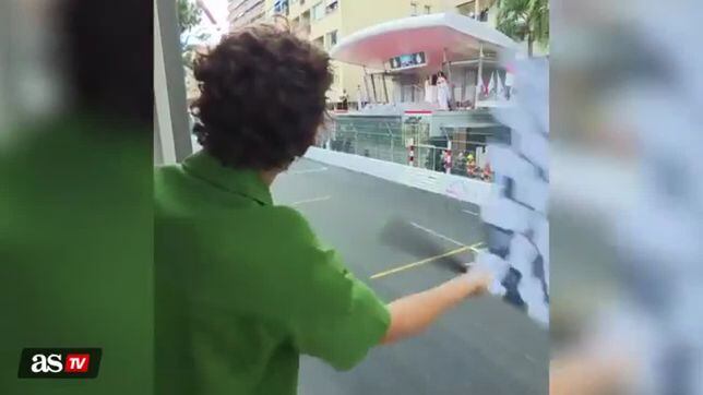 Tom Holland waves checkered flag at Monaco Grand Prix