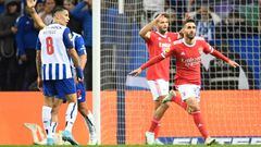 Benfica's Portuguese midfielder Rafa Silva (R) celebrates after scoring his team's first goal during the Portuguese league football match between FC Porto and SL Benfica at the Dragao stadium in Porto, on October 21, 2022. (Photo by MIGUEL RIOPA / AFP) (Photo by MIGUEL RIOPA/AFP via Getty Images)