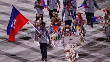 Tokyo 2020 Olympics - The Tokyo 2020 Olympics Opening Ceremony - Olympic Stadium, Tokyo, Japan - July 23, 2021. Flag bearers Sabiana Anestor of Haiti and Darrelle Valsaint Jr of Haiti lead their contingent during the athletes parade at the opening ceremon