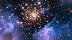 A cluster of young stars resembles an aerial burst, surrounded by clouds of interstellar gas and dust, in a nebula NGC 3603 located in the constellation Carina.