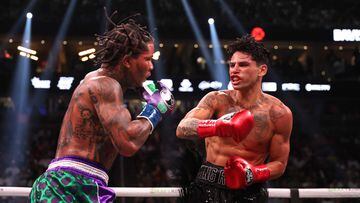 LAS VEGAS, NEVADA - APRIL 22: Ryan Garcia in the black trunks exchanges punches with Gervonta Davis in the green and purple trunks during their catchweight bout at T-Mobile Arena on April 22, 2023 in Las Vegas, Nevada.   Al Bello/Getty Images/AFP (Photo by AL BELLO / GETTY IMAGES NORTH AMERICA / Getty Images via AFP)