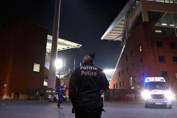 A police officer stands guard outside the King Baudouin Stadium following the Euro 2024 qualifying football match between Belgium and Sweden in Brussels on October 16, 2023, after two Swedes were shot dead in an attack in Brussels. 