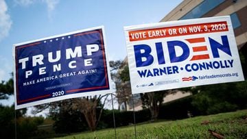 FILE PHOTO: Yard signs supporting U.S. President Donald Trump and Democratic U.S. presidential nominee and former Vice President Joe Biden are seen outside of an early voting site at the Fairfax County Government Center in Fairfax, Virginia, U.S., Septemb