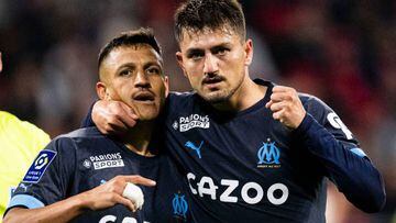 LYON, FRANCE - APRIL 23: Cengiz Under of Marseille (R) celebrates his goal with his teammate Alexis Sanchez (L) during the Ligue 1 match between Olympique Lyonnais and Olympique de Marseille at Groupama Stadium on April 23, 2023 in Lyon, France. (Photo by Marcio Machado/Eurasia Sport Images/Getty Images)