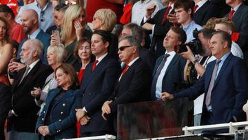 Stan Kroenke (centre) attends a match at the Emirates with his family.