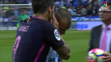 Suárez (left) is seen complaining to Sandro over his goal celebration after scoring against his former club.