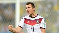 (FILE) A photo taken on June  21, 2014 shows Germany's forward Miroslav Klose celebrats after scoring during a Group G football match between Germany and Ghana at the Castelao Stadium in Fortaleza during the 2014 FIFA World Cup . Klose, the all-time World Cup top scorer, has retired from international football, the German football federation announced on August 11, 2014.
AFP PHOTO / JAVIER SORIANO