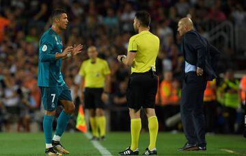 Real Madrid's Portuguese forward Cristiano Ronaldo (L) leaves the field after receiving his second yellow card during the Spanish Supercup first leg football match FC Barcelona vs Real Madrid at the Camp Nou stadium in Barcelona on August 13, 2017.