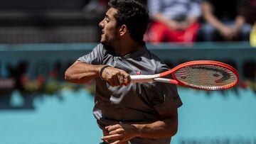 Cristian Garin of Chile returns the ball to Russia&#039;s Daniil Medvedev during their match at the Mutua Madrid Open tennis tournament in Madrid, Spain, Thursday, May 6, 2021. (AP Photo/Bernat Armangue)