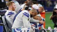 ARLINGTON, TEXAS - JANUARY 14: Dak Prescott #4 of the Dallas Cowboys sits on the bench during the fourth quarter of the NFC Wild Card Playoff game against the Green Bay Packers at AT&T Stadium on January 14, 2024 in Arlington, Texas. The Packers defeated the Cowboys 48-32.   Richard Rodriguez/Getty Images/AFP (Photo by Richard Rodriguez / GETTY IMAGES NORTH AMERICA / Getty Images via AFP)