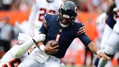 CLEVELAND, OHIO - SEPTEMBER 26: Justin Fields #1 of the Chicago Bears is tackled during the second half in the game against the Cleveland Browns at FirstEnergy Stadium on September 26, 2021 in Cleveland, Ohio.   Emilee Chinn/Getty Images/AFP == FOR NEWSP