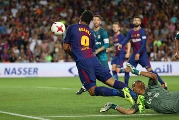 Barcelona’s Luis Suarez is judged to have been brought down by Real Madrid’s Keylor Navas for a penalty.