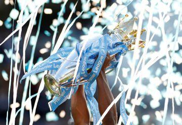 Manchester City's Vincent Kompany lifts the 2018/19 Premier League trophy.