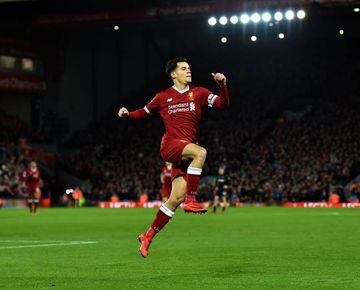 Philippe Coutinho of Liverpool celebrates after scoring the opening goal during the Premier League match between Liverpool and Swansea City