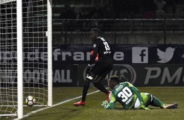 Chambly's Lassana Doucoure (L) scores a goal during French Cup quarter-final football match between Chambly and Strasbourg on February 28, 2018, at the Pierre Brisson Stadium in Beauvais, northern France