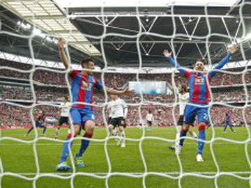 Crystal Palace's Scott Dann and Connor Wickham watch Jason Puncheon's strike nestle into the back of the net.