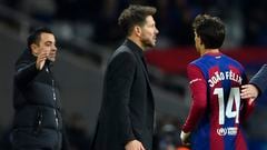 Barcelona's Portuguese forward #14 Joao Felix walks past Atletico Madrid's Argentinian coach Diego Simeone as Barcelona's Spanish coach Xavi (L) waits for shaking hands with him after being substituted during the Spanish league football match between FC Barcelona and Club Atletico de Madrid at the Estadi Olimpic Lluis Companys in Barcelona on December 3, 2023. (Photo by Pau BARRENA / AFP)